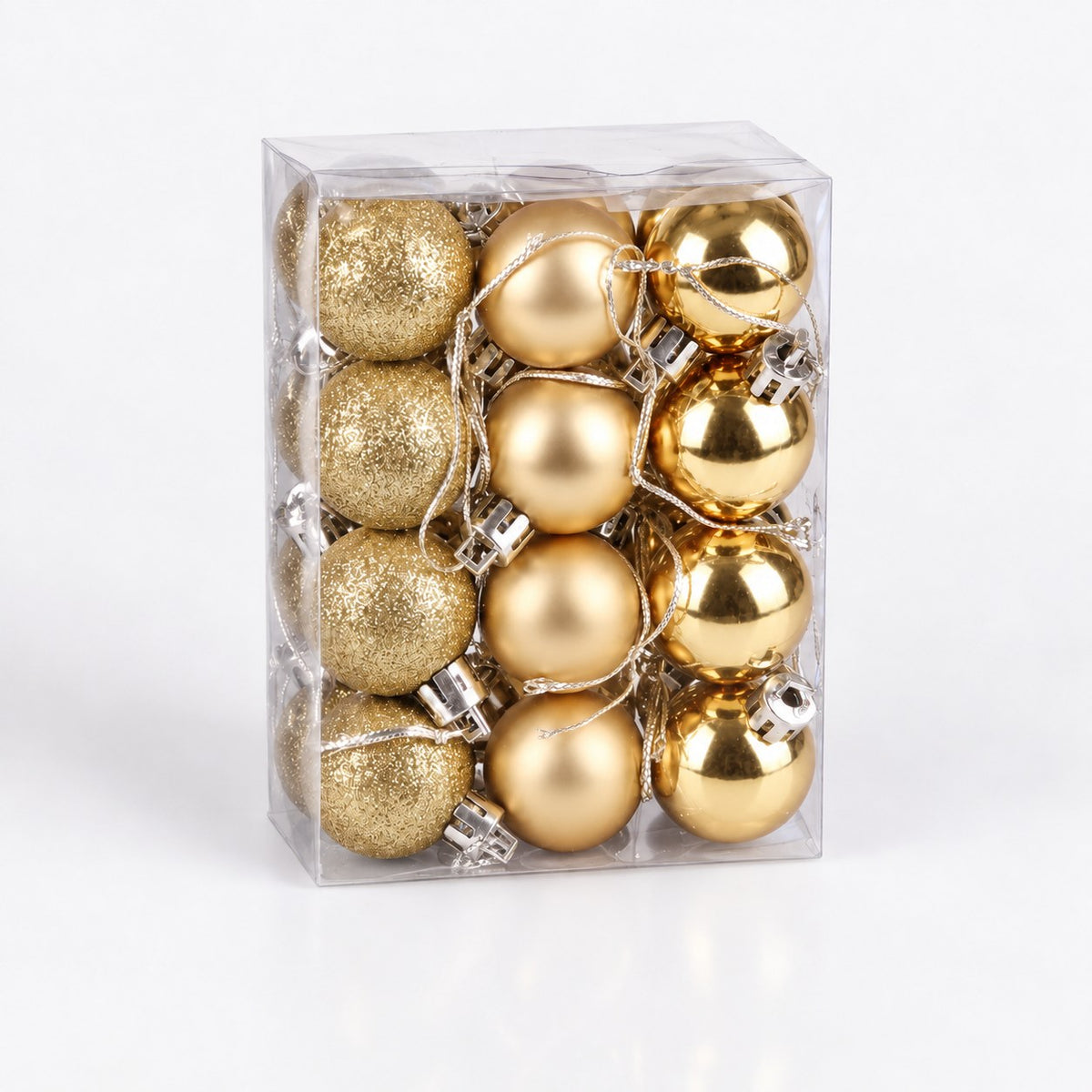 Caja transparente con 24 bolas doradas de Navidad